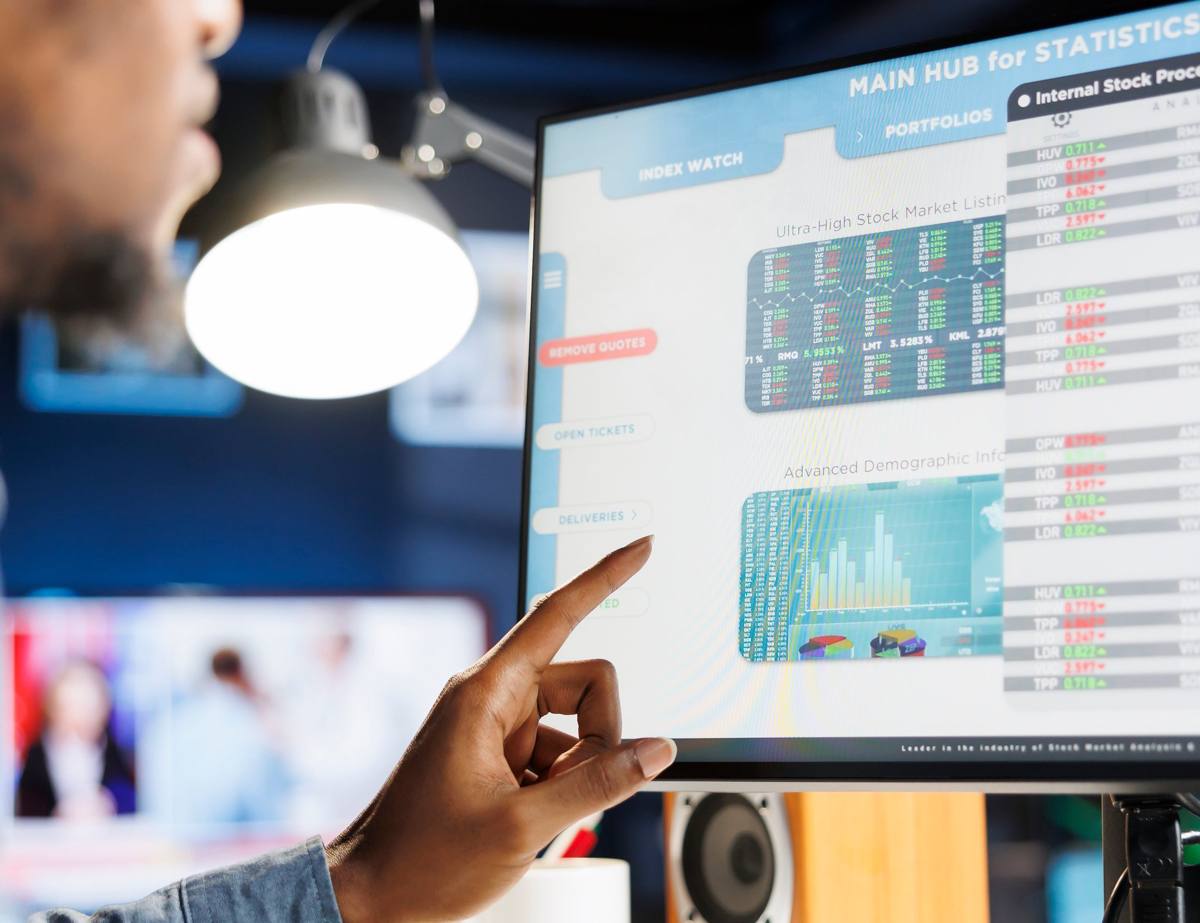 Analysts reviewing cost and viability data on screen